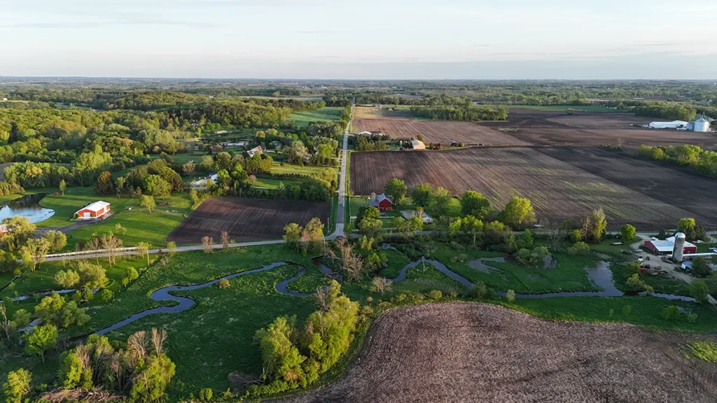 An aerial photograph of tree lined farm field. Wisco Aerial & Ground Services provides aerial photography and videography to all of Southern Wisconsin.